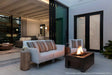 Stone patio with gas burning fire pit and modern stylish outdoor furniture